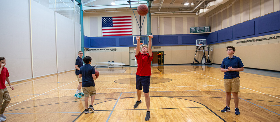 STCA student playing basketball image